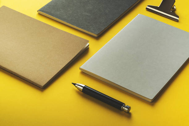 istock Black and white back to school accessories flat lay on yellow background. 1021688590