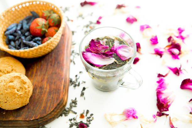 Cup of tea and mint on a wooden background