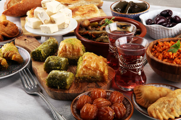 istock Middle eastern or arabic dishes and assorted meze, concrete rustic background. sambusak. Turkish Dessert Baklava with pistachio. Sarma. Halal food. Lebanese 1021693790