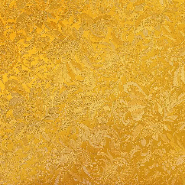 Photo of Golden floral ornament brocade textile pattern