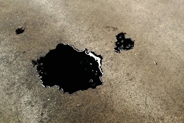 istock black dirty oil on concrete ground 1021697988