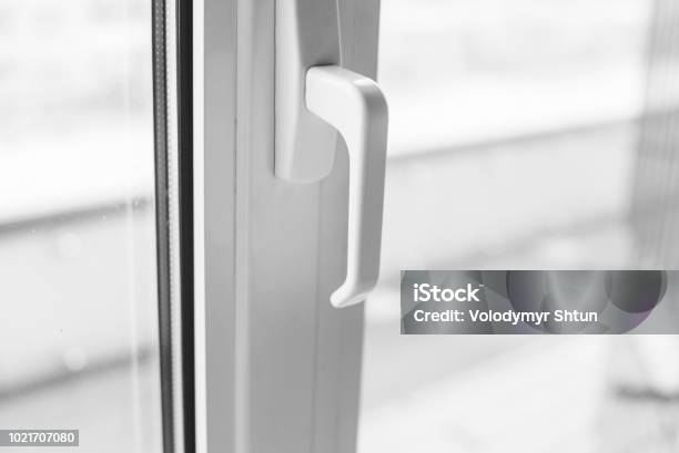 Closeup On A White Handle Of The Pvc Window Stock Photo - Download Image Now - Window, Door, Aluminum