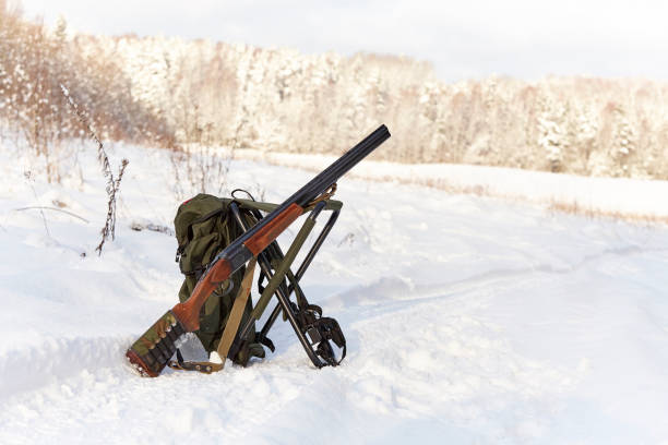 istock hunting season. shotgun on hunting backpack 1021714782