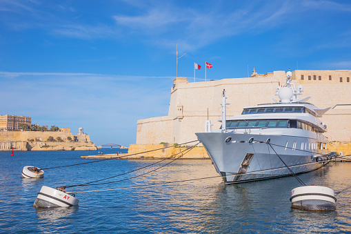 Valletta, Malta - February 5, 2017:   Luxuty boats moored in front of the St Angelo fort