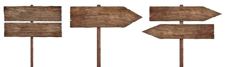 Three empty weathered roadsigns made of dark old wood. Pointing in different directions. Isolated on white background.