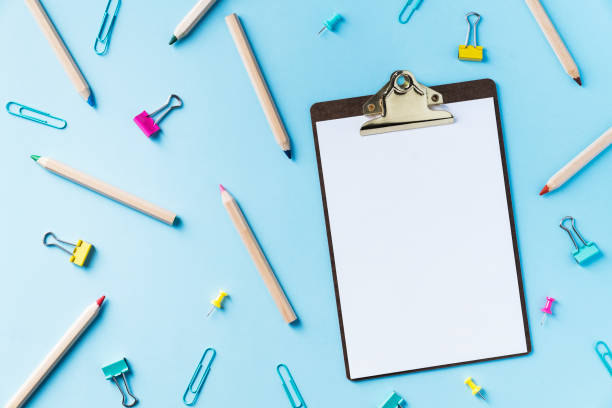 istock Colorful back to school flat lay and clipboard on blue background 1021721978