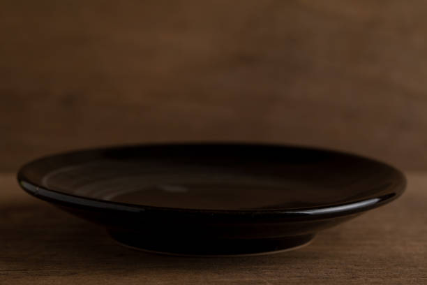 istock Ceramic plate on wooden floor 1021722264