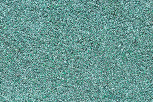 istock Rubber floor texture. Granules playground cover background. 1021728322