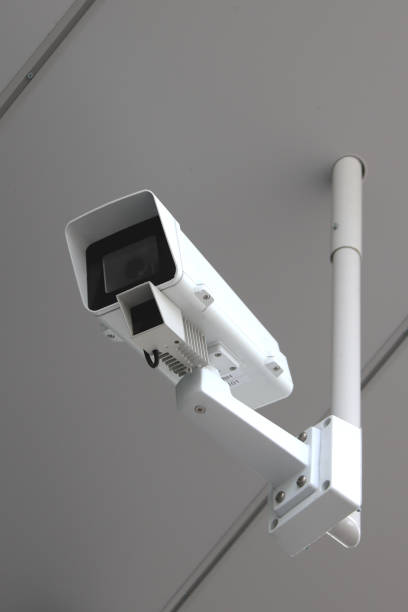 istock White street camera. Police protection control. 1021728908