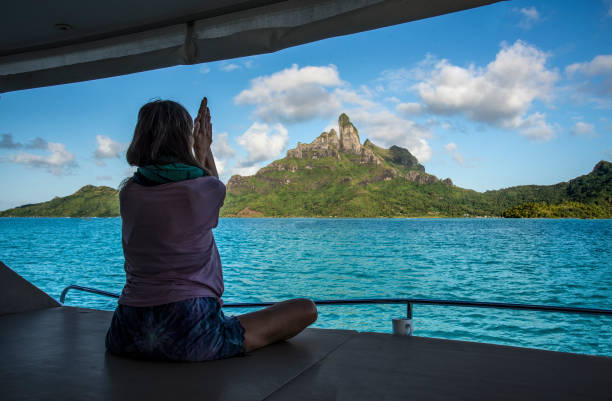 istock Morning yoga with Mount Otemanu 1021735146