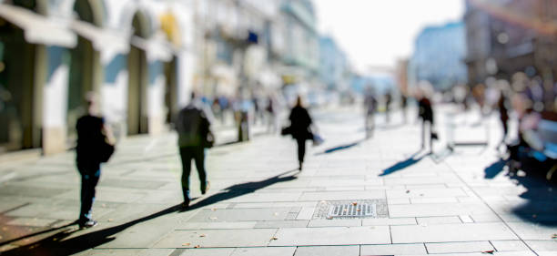 istock crowd of people walking on sunny streets 1021735626