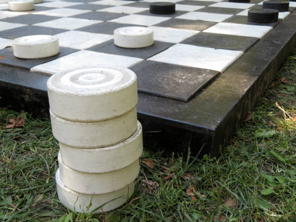 istock Board with large street checkers on the grass 1021735998