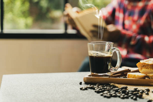 istock a coffee set on desk with people sit behind besie window 1021736258