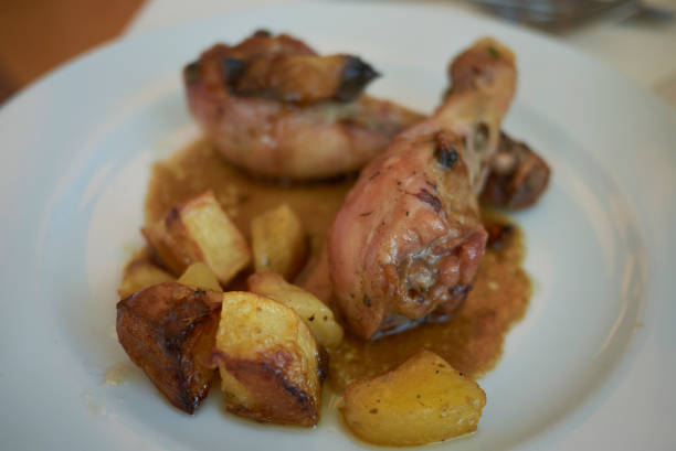 istock Chicken legs and roasted potatoes 1021736846