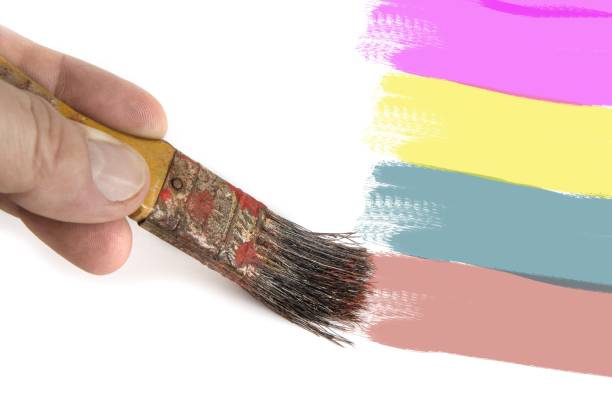 istock Old brush in man's hand on the white 1021744032