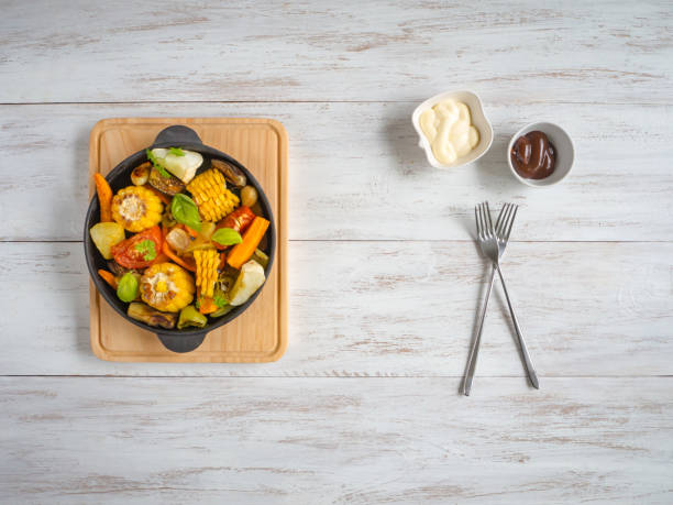 istock Baked corn with vegetables. Rustic food. 1021761538