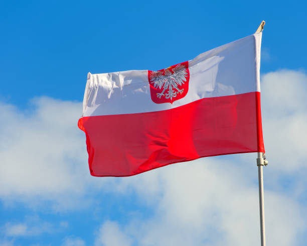 istock Polish flag with emblem of white eagle. 1021772210