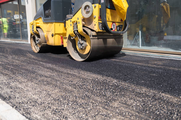istock Diesel roller drives over fresh asphalt to condense the road. 1021778850