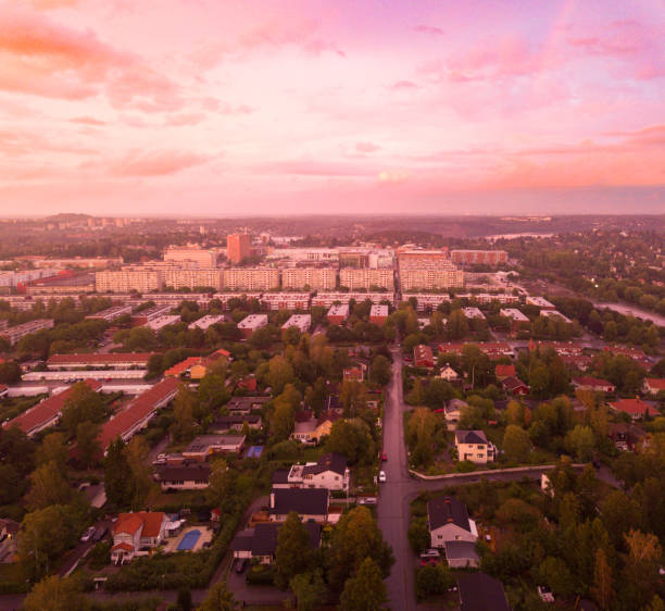 istock Sunset over villa area, drone view, dramatic sky, malmvagen 1021778934
