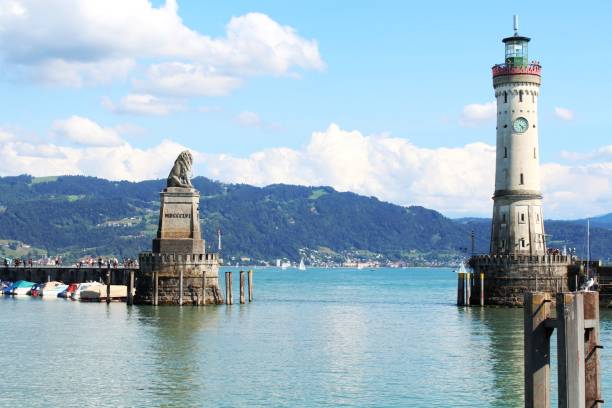 Port of Lindau with lion and lighthouse Lindau, Lake Constance, harbour, entrance, lion, lighthouse, Bavaria bregenz stock pictures, royalty-free photos & images