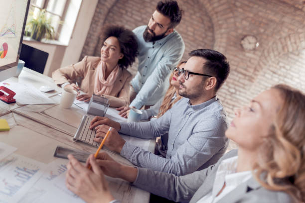 istock Business people working on project and showing successful graph 1021802722