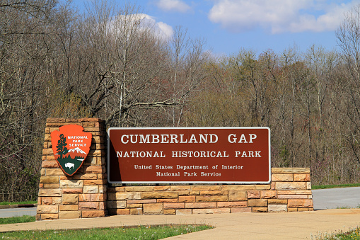 Middlesboro, KY – APRIL 10, 2018: A sign welcomes visitors to Cumberland Gap National Historical Park, which straddles the border between Tennessee, Kentucky, and Virginia