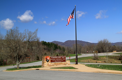 Middlesboro, KY – APRIL 10, 2018: A sign welcomes visitors to Cumberland Gap National Historical Park, which straddles the border between Tennessee, Kentucky, and Virginia