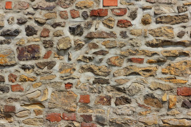 istock Old brick wall, background of bricks, stone masonry test with cement, blank for designer, pattern in a vintage style 1021803446