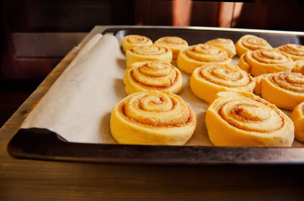 Homemade cinnamon rolls on a metal a baking sheet