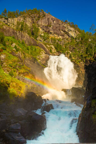 istock Waterfall Latefossen at sunset lights in summer, Norway 1021814364