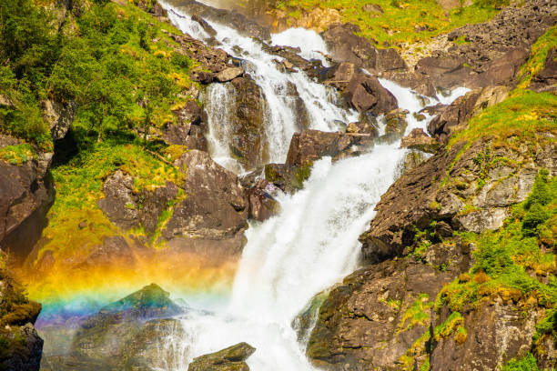 waterfall latefossen at sunset lights in summer, norway - bridge norway odda falling imagens e fotografias de stock