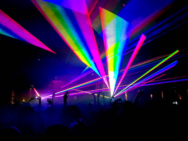 Rainbow laser lights in nightclub stock photo