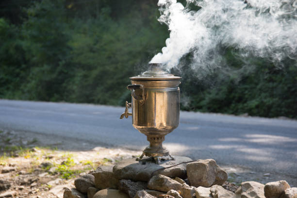 istock Vintage style samovar. Water poured into the samovar is heated by the fire burning. 1021826482