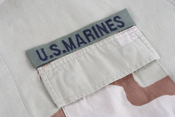 istock US MARINES branch tape with dog tags on desert camouflage uniform 1021833266