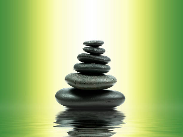 istock Zen basalt stones with green bamboo on water. Spa and Wellness concept. 1021844522