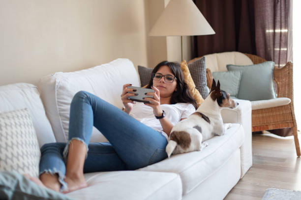 istock Attractive young woman sharing a sofa 1021854518