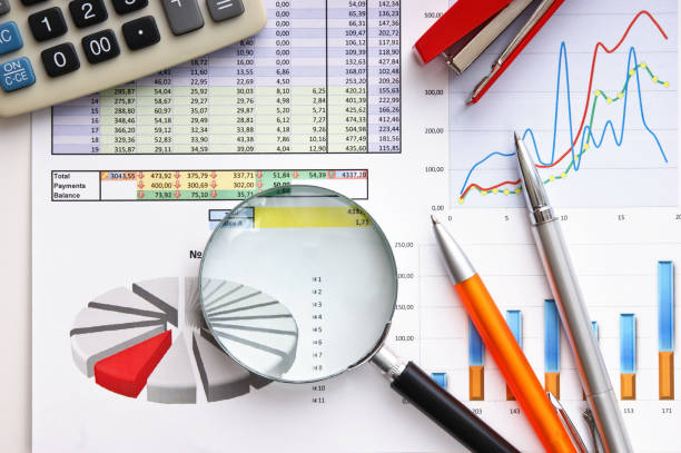 istock magnifying glass and the working paper 1021859300