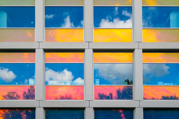 Reflections in colorful coated windows Reflections in colorful coated windows of the building for Applied Sciences of the Delft University of Technology, Netherlands dutch architecture stock pictures, royalty-free photos & images