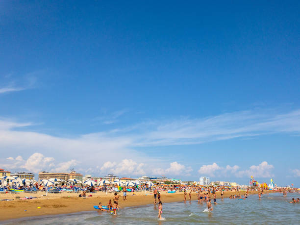 Bibione, (VE), Italy - August 11, 2018:Tourists sunbathe and walking in the beach of Bibione on the Adriatic Sea