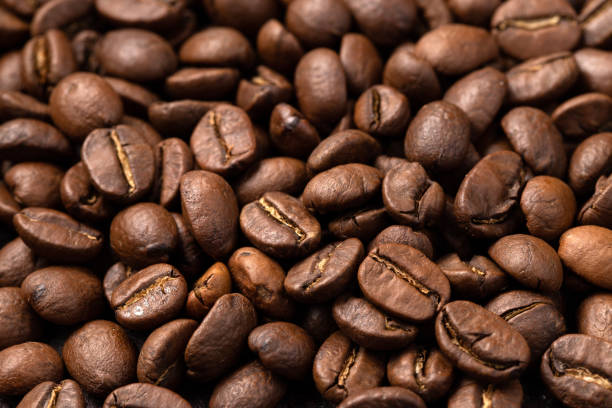 istock Close-up roasted coffee beans background. Top view 1021868136