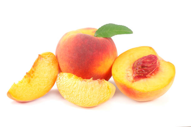 istock peach fruit with green leaf and slices isolated on white background 1021874102