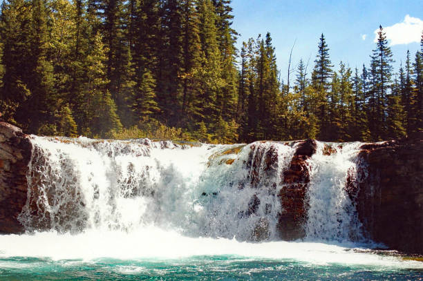 istock Sheep River waterfall in spring with snow runoff 1021878788