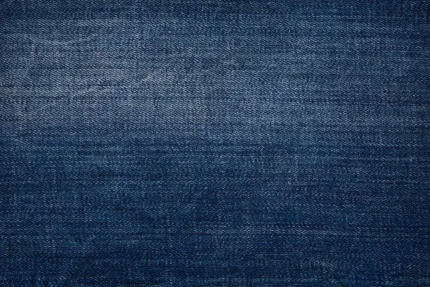 Texture of dark grated denim as background. Close-up