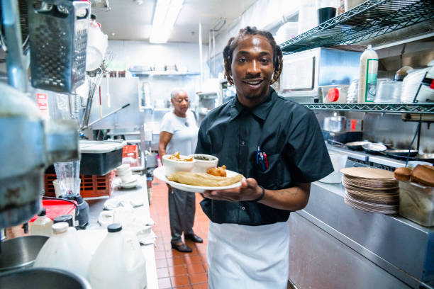 istock The young Black man working on the industrial kitchen 1021883930