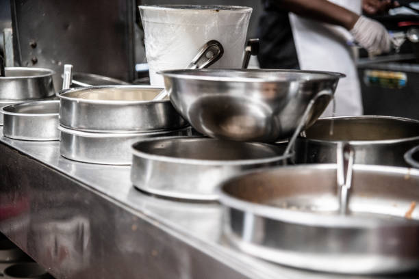 Kitchenware - cooking pots, oven and other dishware - in the industrial kitchen in the small restaurant