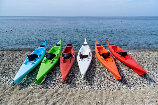 Multicolored bright kayaks on the beach on a sunny day. Multicolored bright kayaks on the beach on a sunny day. labadee stock pictures, royalty-free photos & images