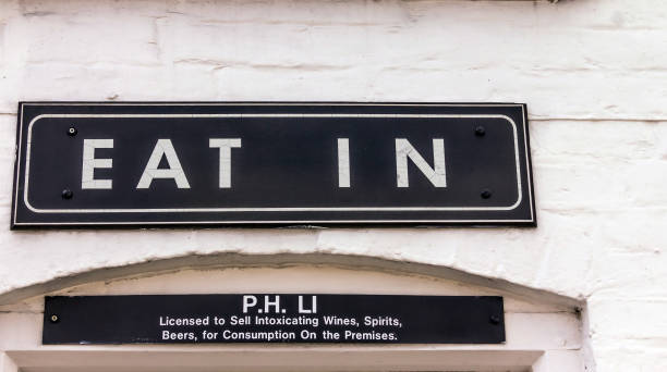 istock Vintage eat in sign in white painted brick wall 1021888614