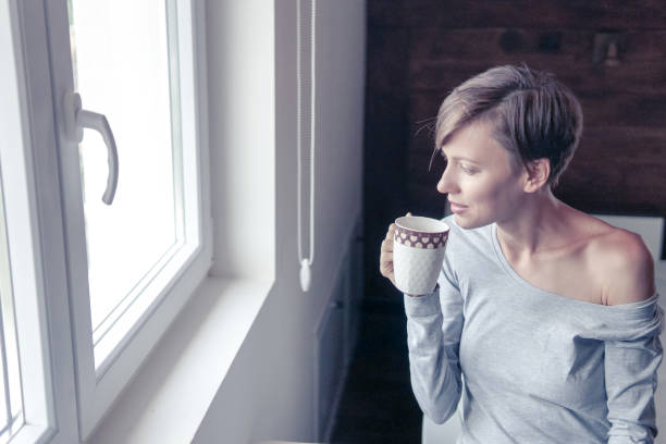 istock Woman drinking morning coffee 1021889778
