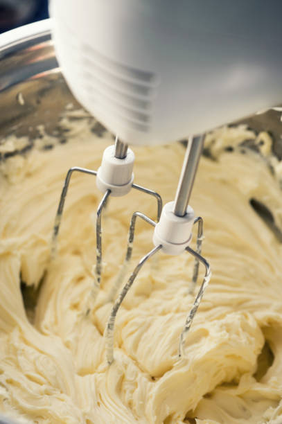 istock Whipped sweet cream with a mixer for dessert 1021898154