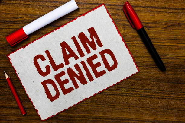 istock Handwriting text writing Claim Denied. Concept meaning Requested reimbursement payment for bill has been refused White paper red borders markers wooden background communicating ideas. 1021898164